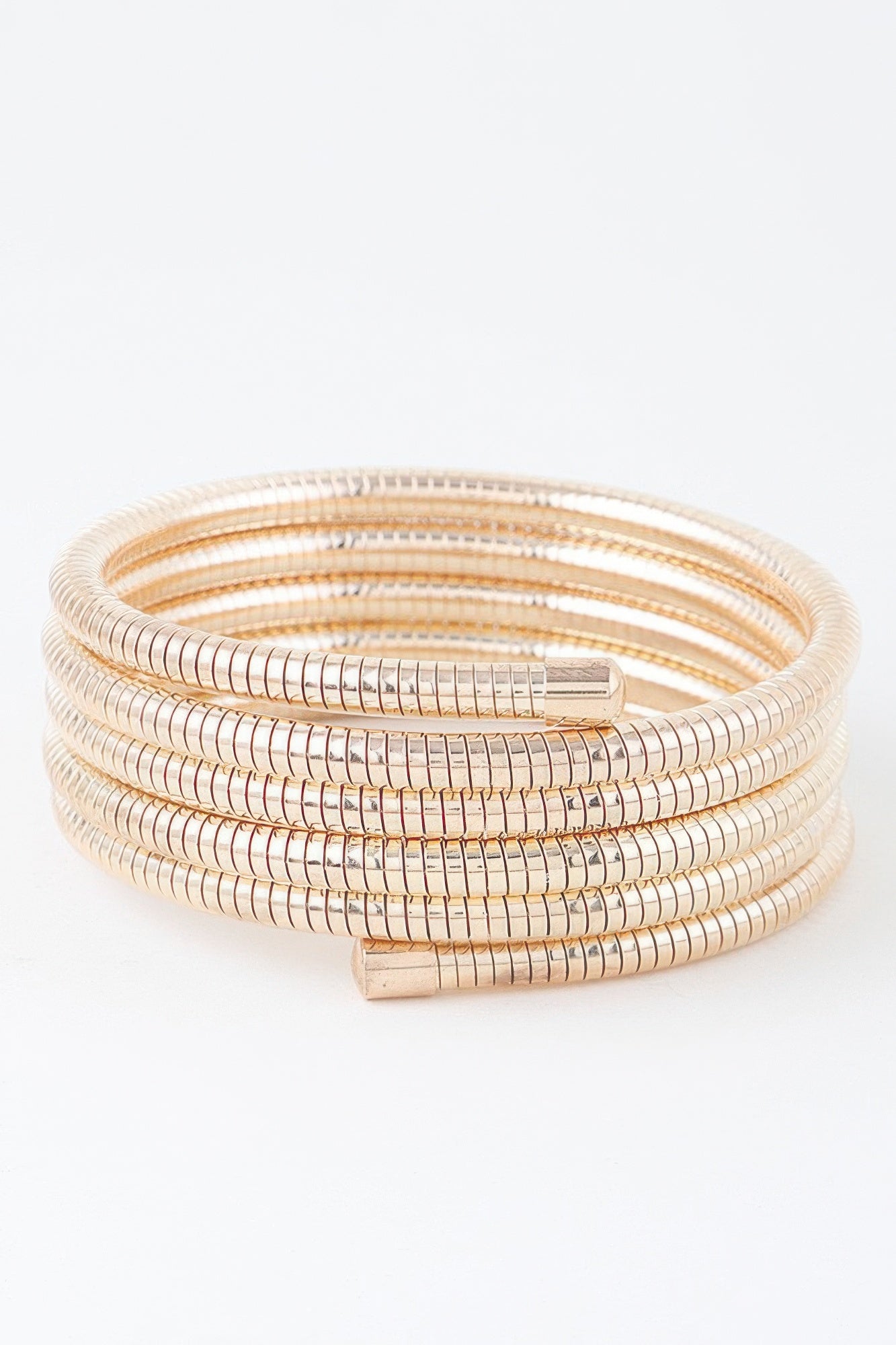 Multi snake chain wrap bracelet in gold tone with rectangular clasp and stacked rows