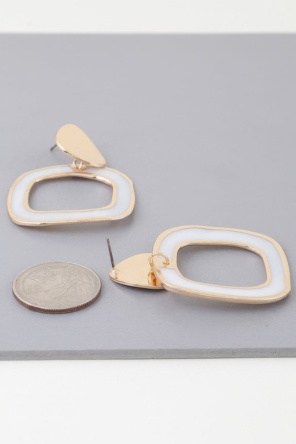 Gold-cream abstract marble frame earrings, large; teardrop stud with oval frame