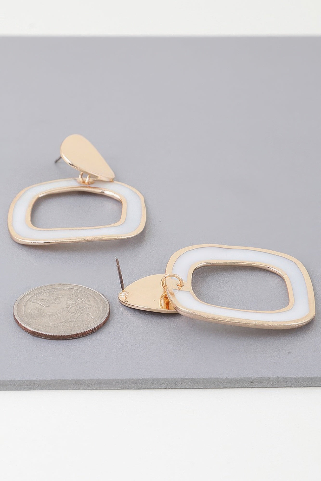 Gold-cream abstract marble frame earrings, large; teardrop stud with oval frame
