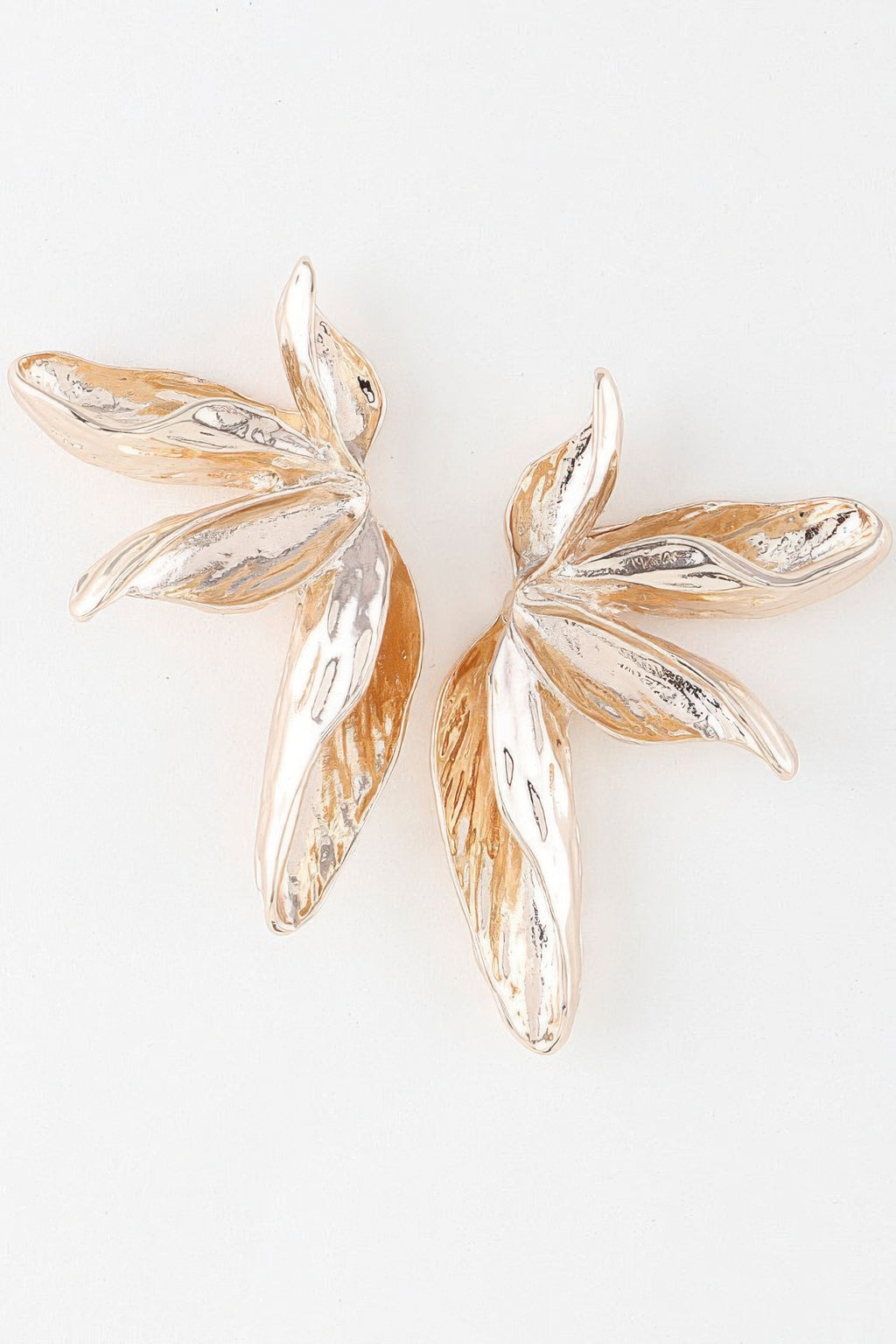 Gold bird-of-paradise flower earrings, sculpted leaf petals with glossy highlights