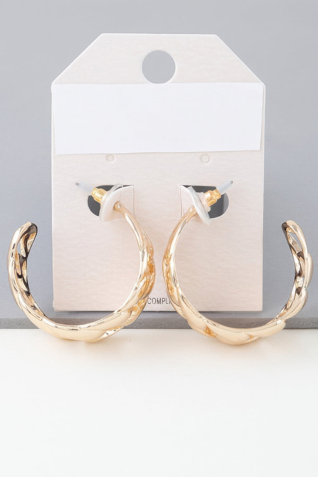 Gold-tone curb braid chain hoop earrings on card, twisted link hoops