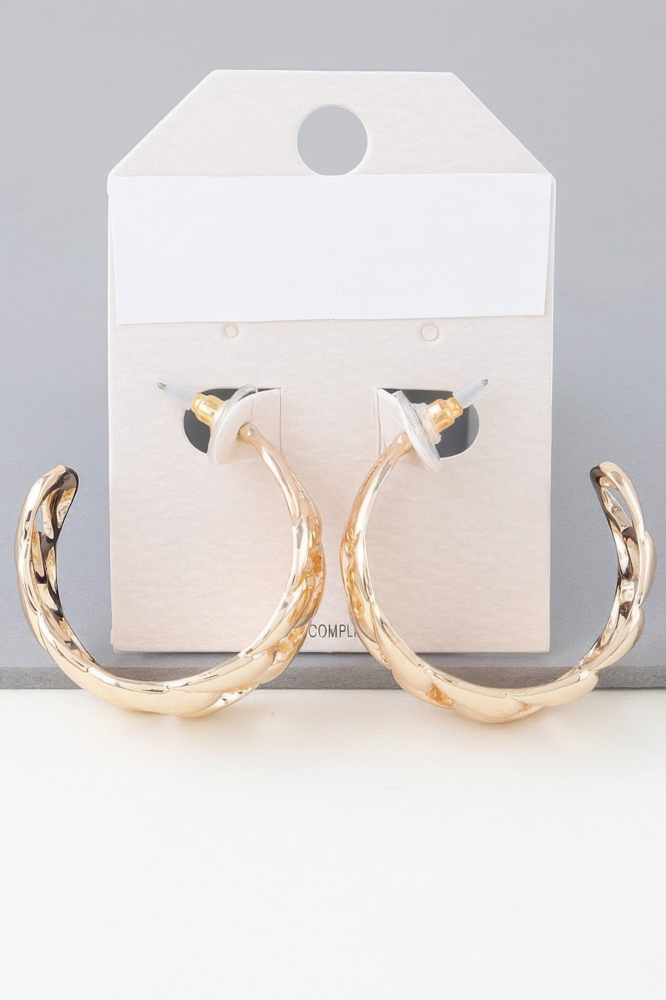 Gold-tone curb braid chain hoop earrings on card, twisted link hoops