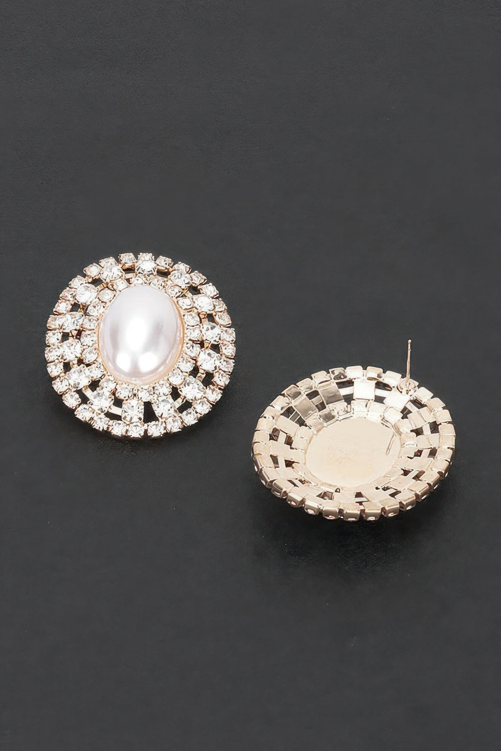 Faux pearl rhinestone stud earring with oval center; back shows gold-tone clasp