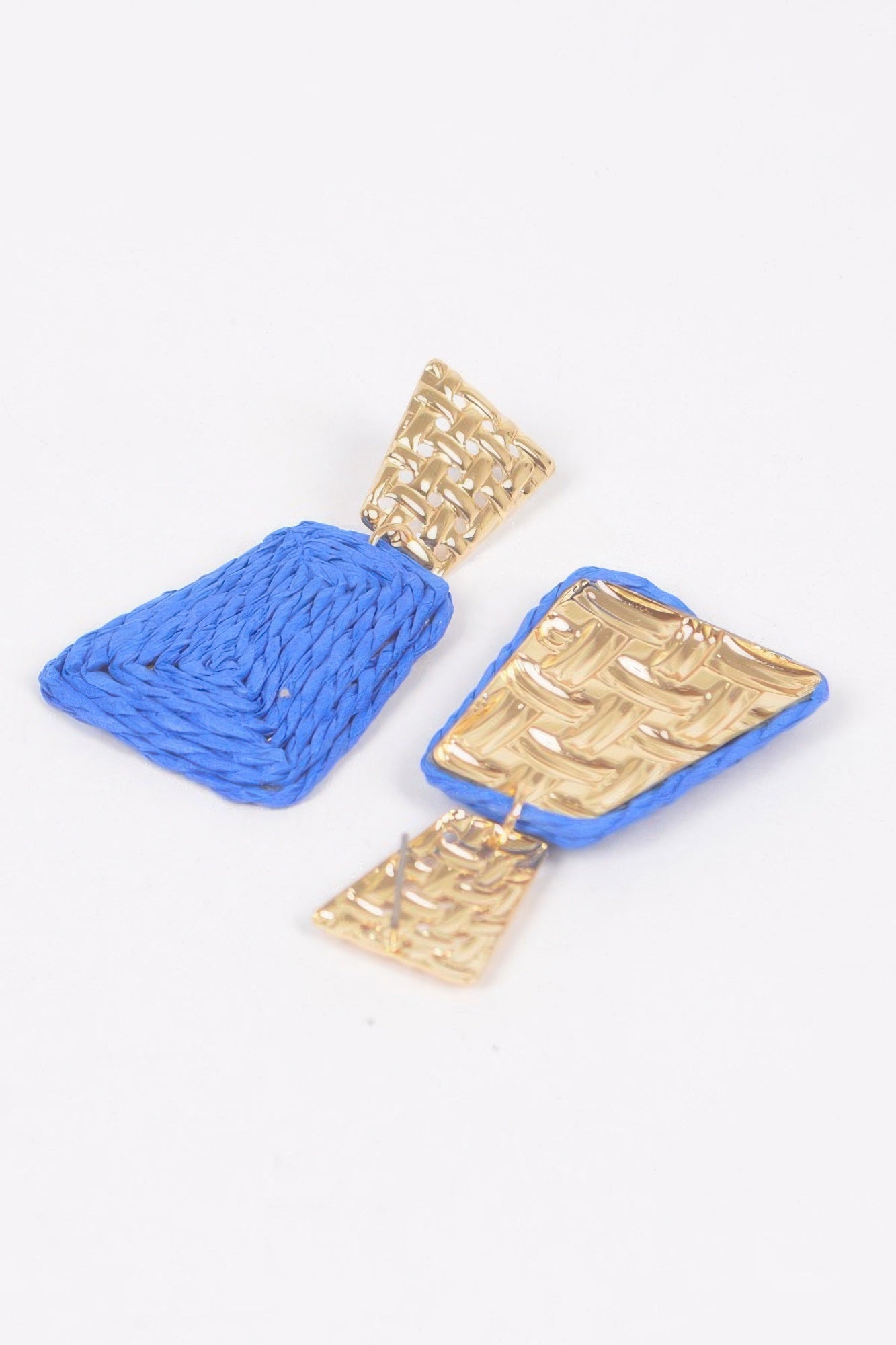 Pair of faux straw dangling earrings in cobalt blue with gold-tone top frames