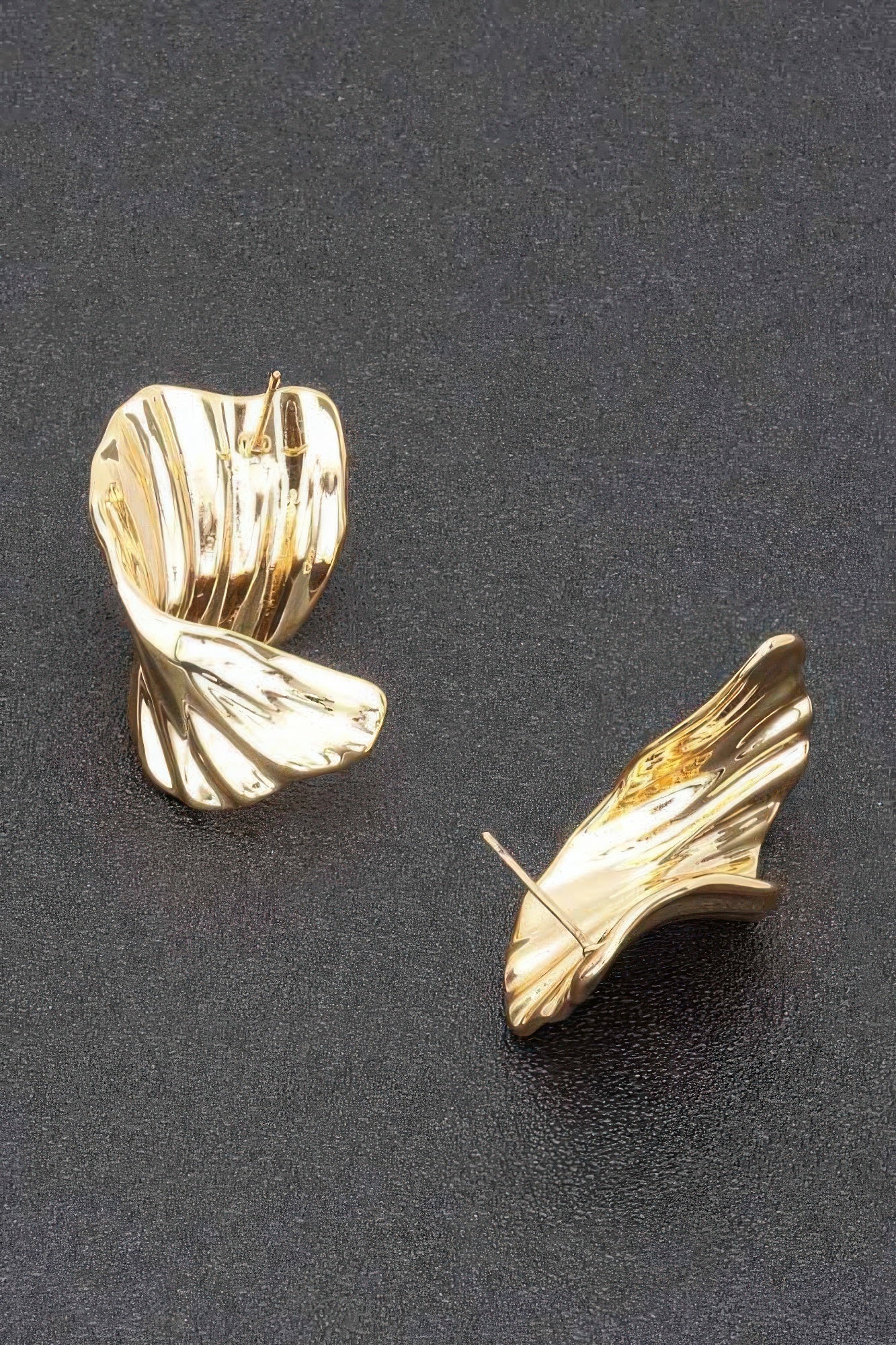 Gold-plated ribbed wave hoop earrings, curved side view, pair