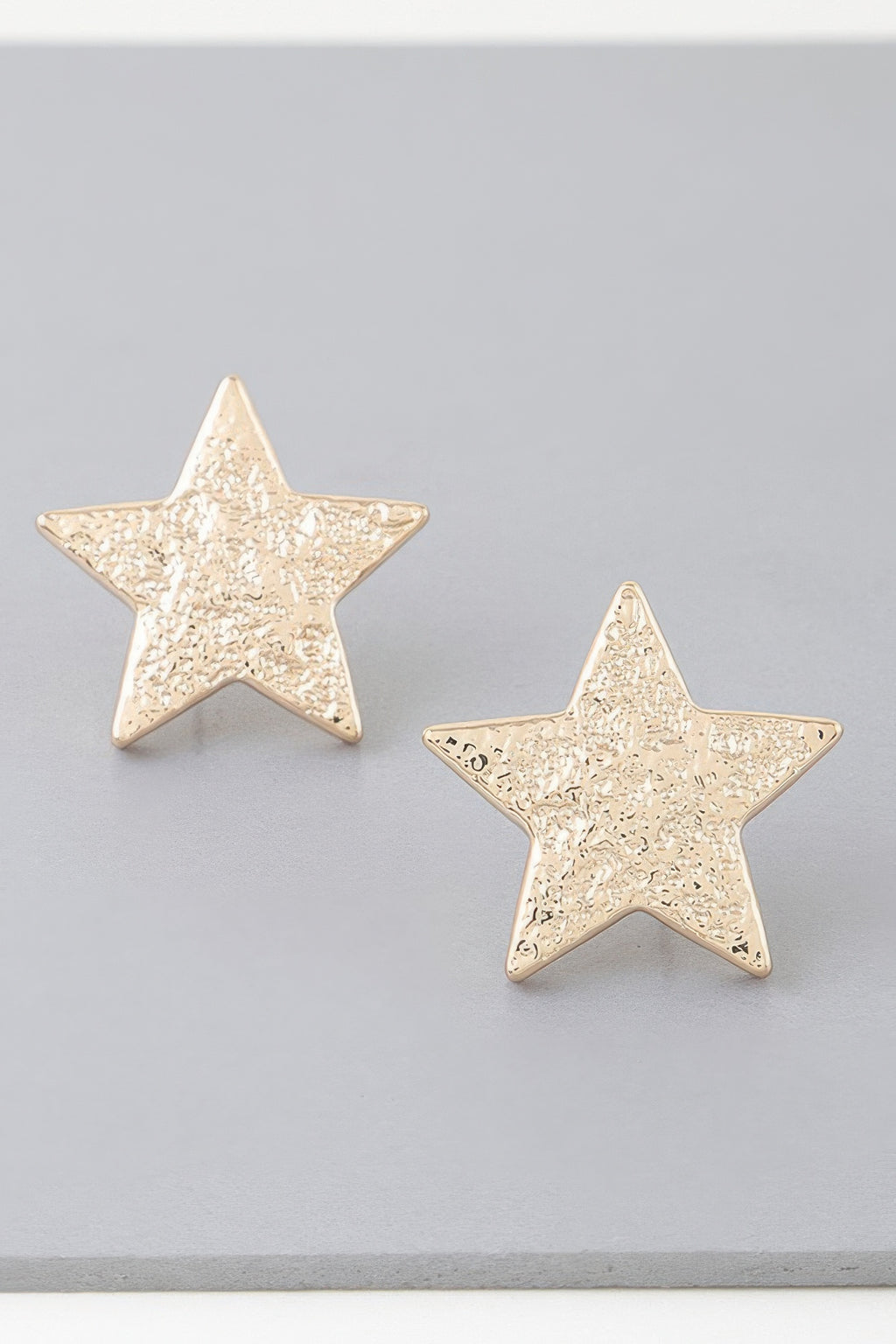 Gold star hammered stud earrings, textured star front pair