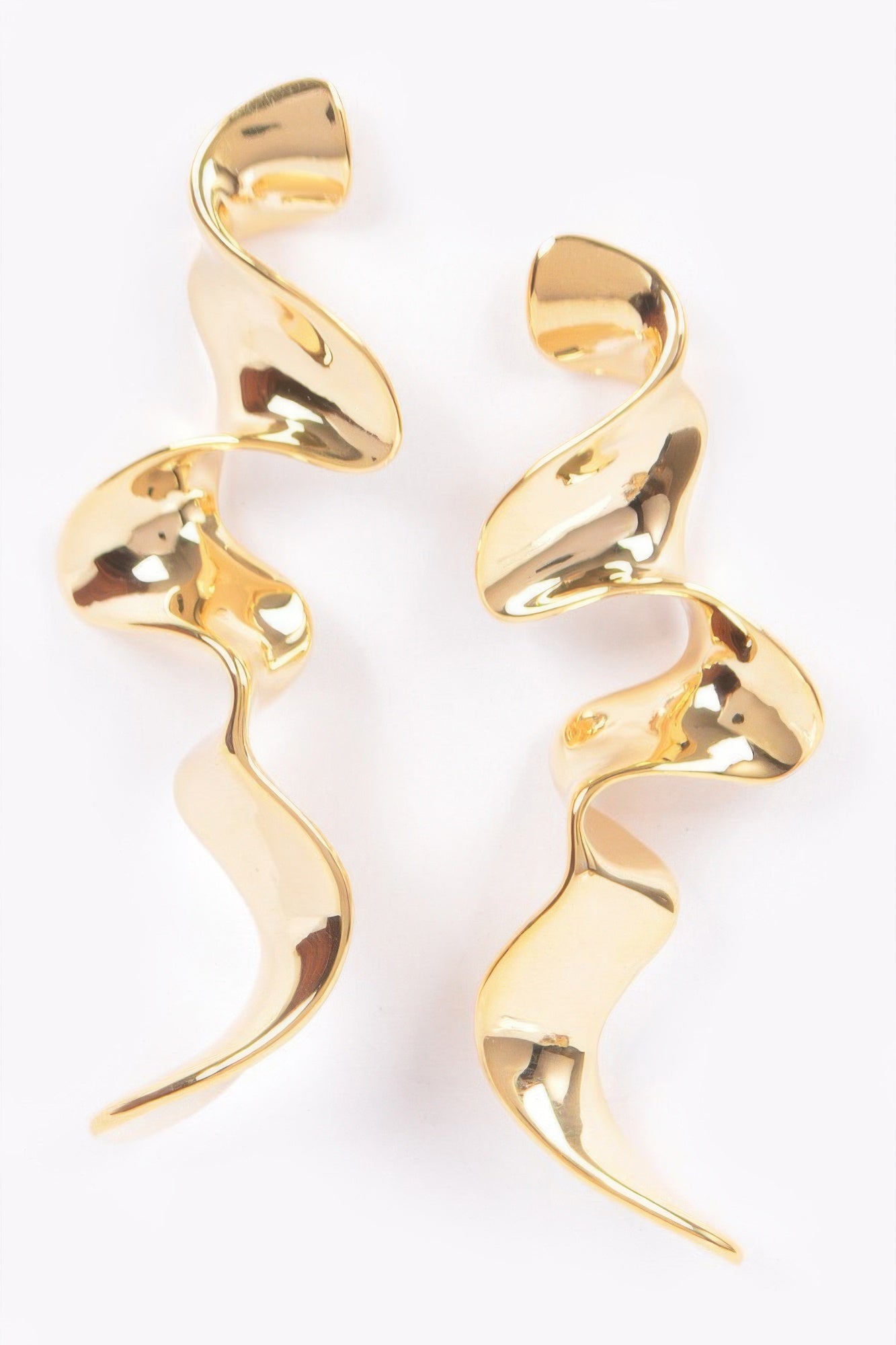 Gold-tone metal plated wave earrings with curving swirl dangle design