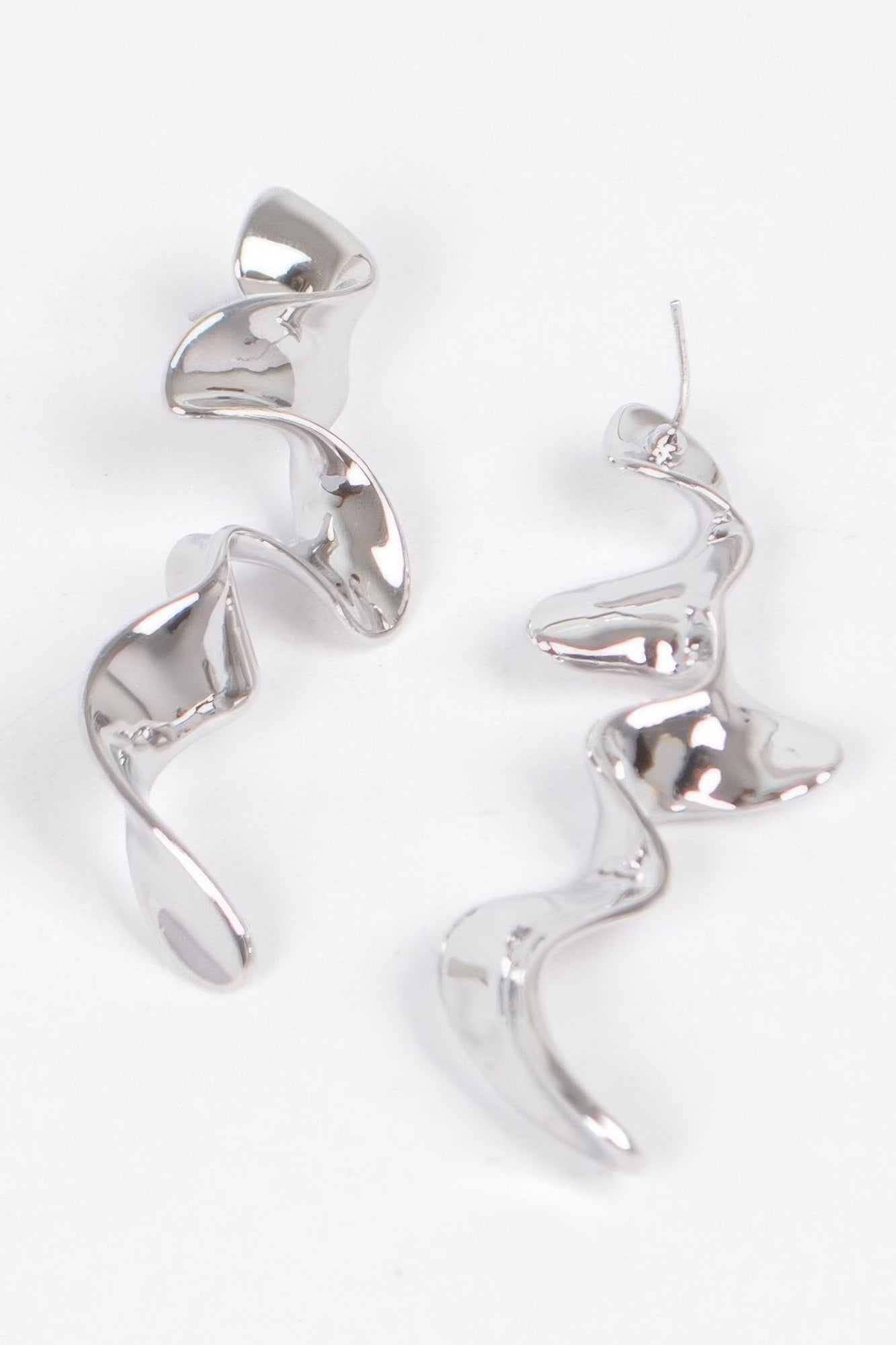 Silver-tone metal plated wave drop earrings with curved swirl dangle design