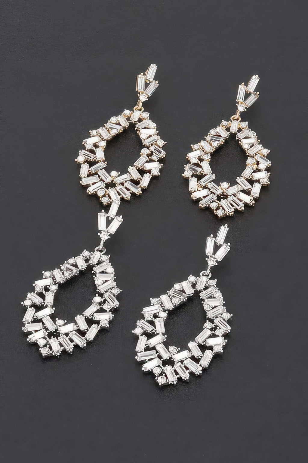 Silver rhinestone drop earrings with circular baguette-stone design