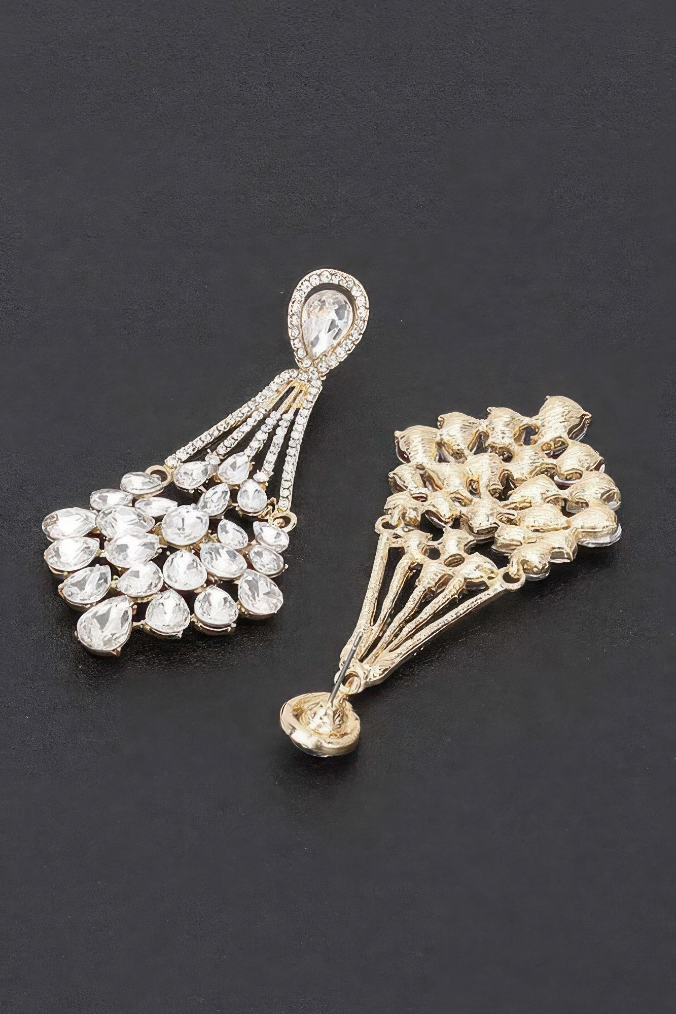 Rhinestone earrings with clear stone tassel dangles in silver and gold tones