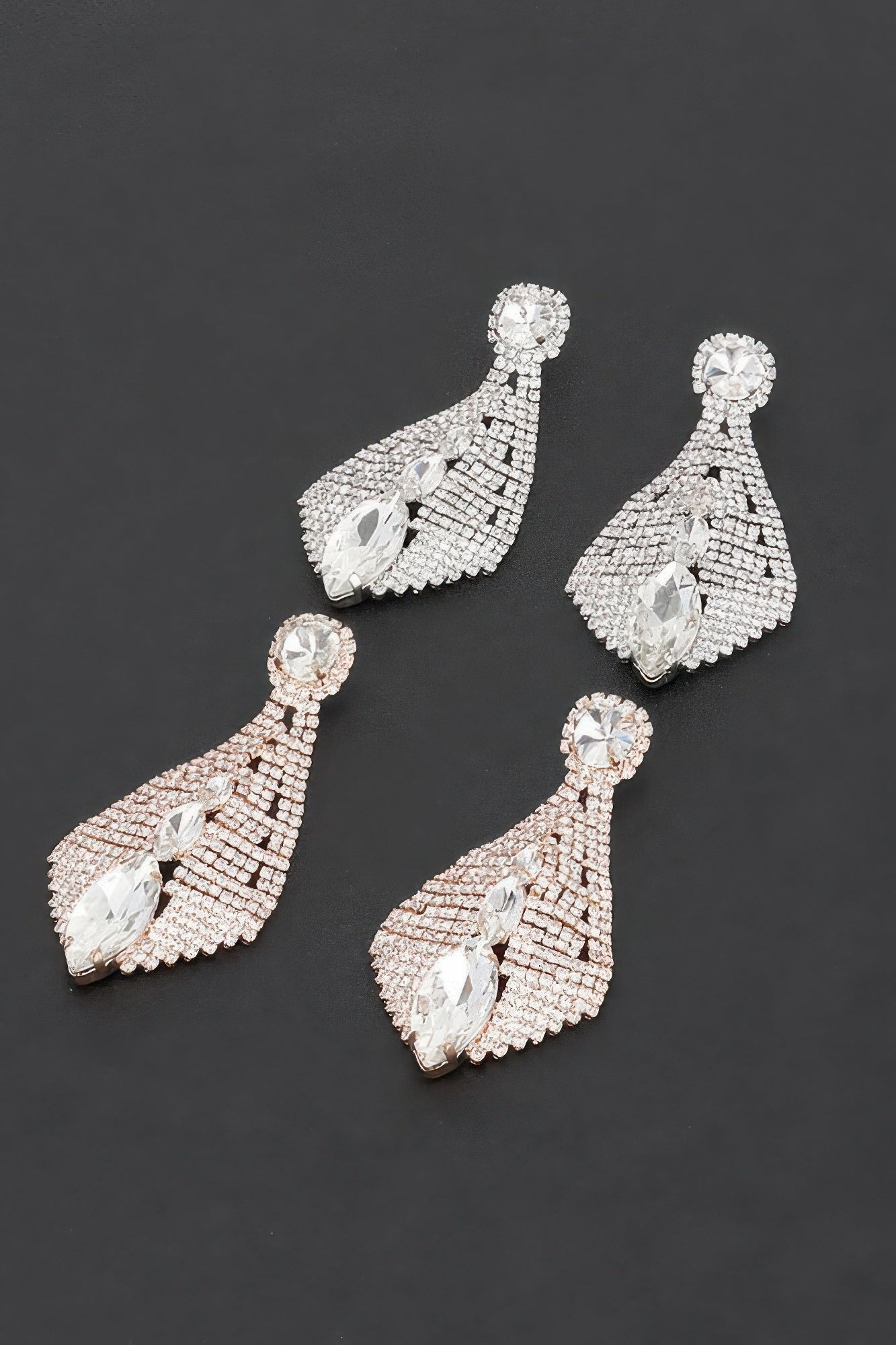 Silver-tone rhinestone drop earrings with teardrop shape and layered clear stones