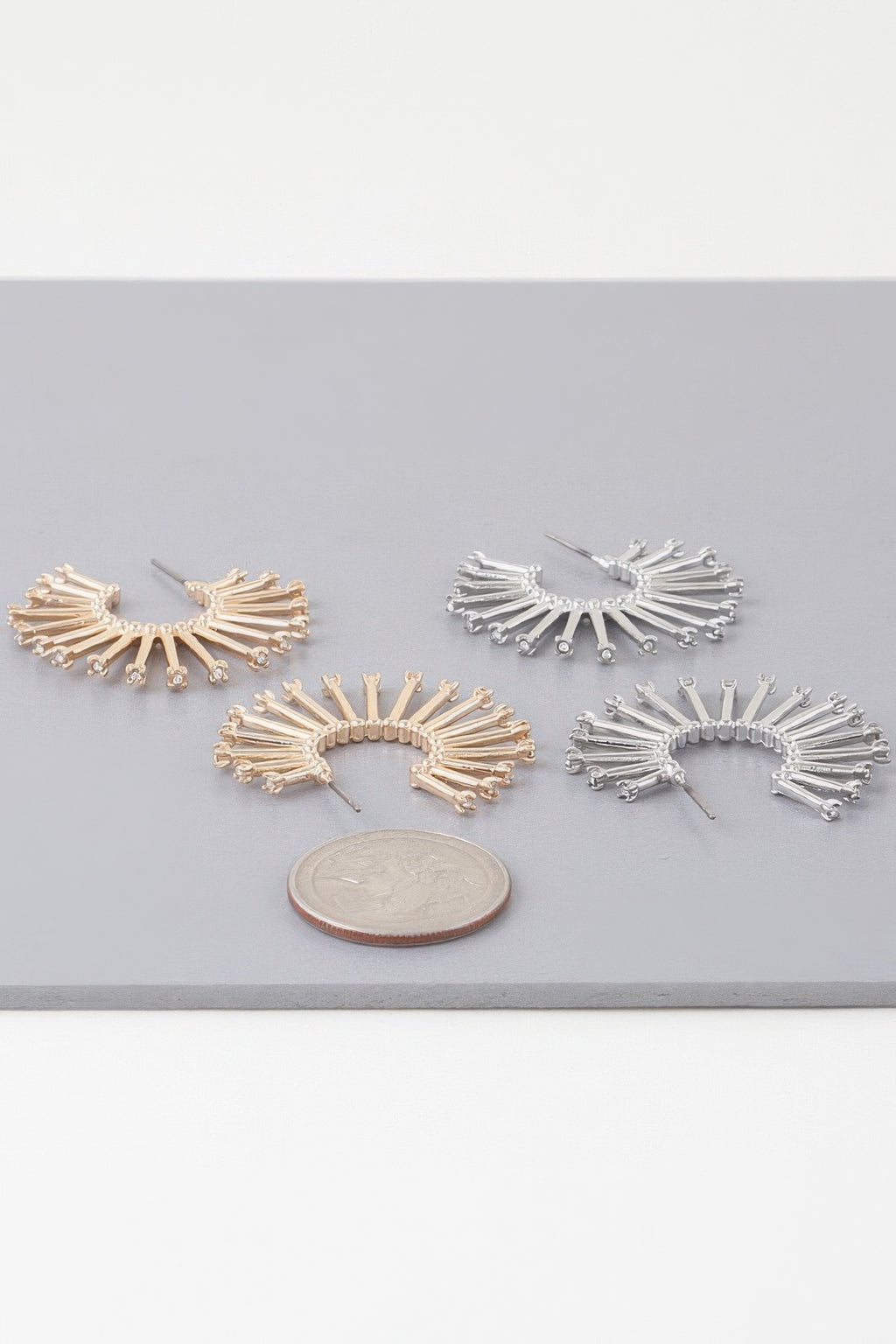 Set of sun hoop earrings: gold and silver radiating rays with clear stones