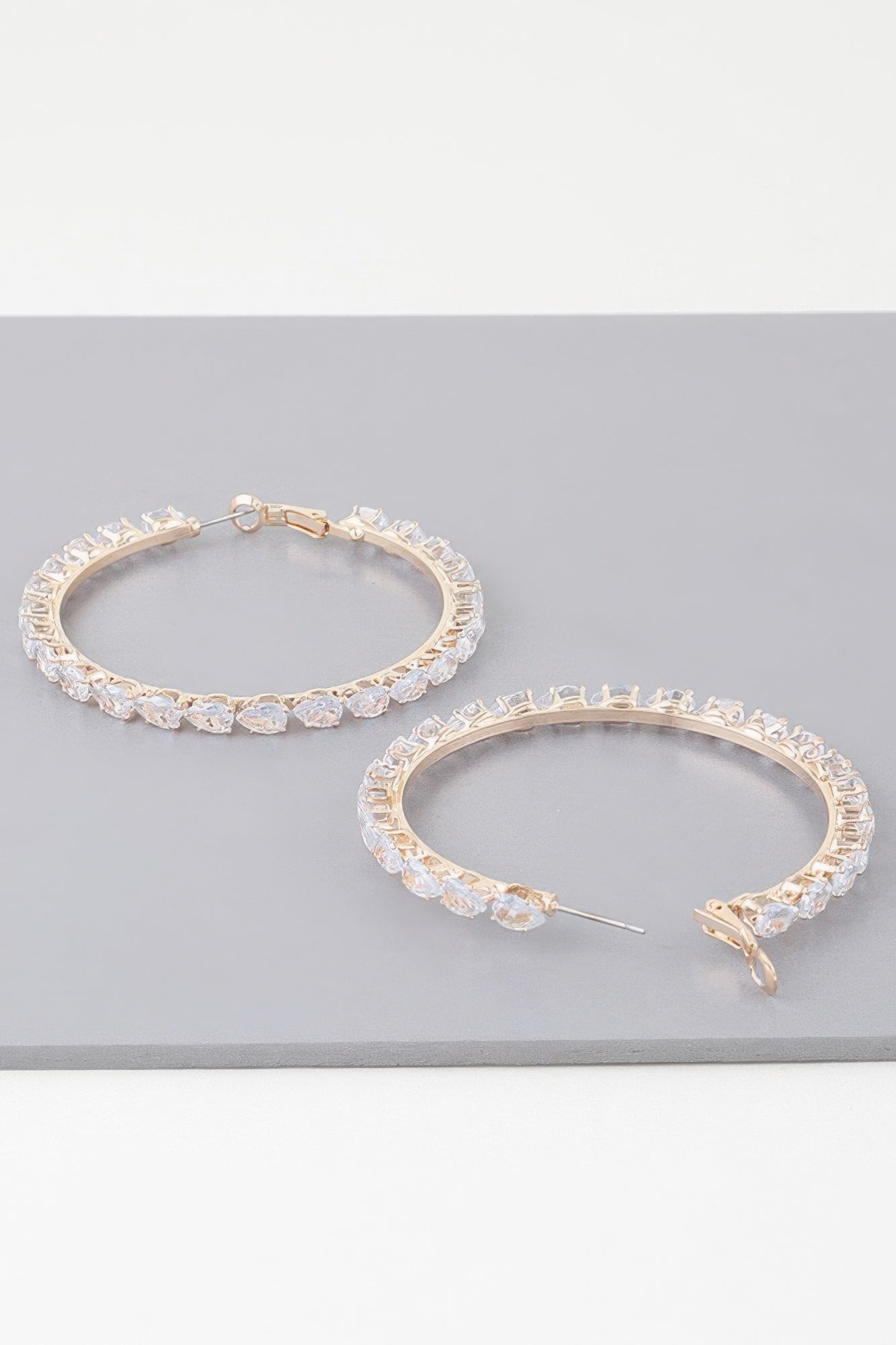 Teardrop jeweled hoop earrings, gold-tone with teardrop-shaped crystal settings