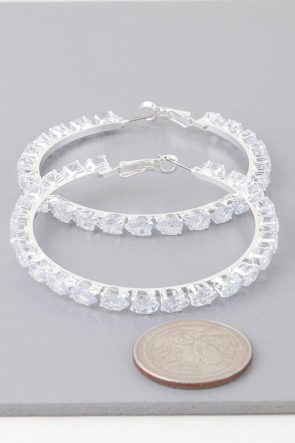 Teardrop jeweled hoop earrings, silver-tone with clear faceted stones