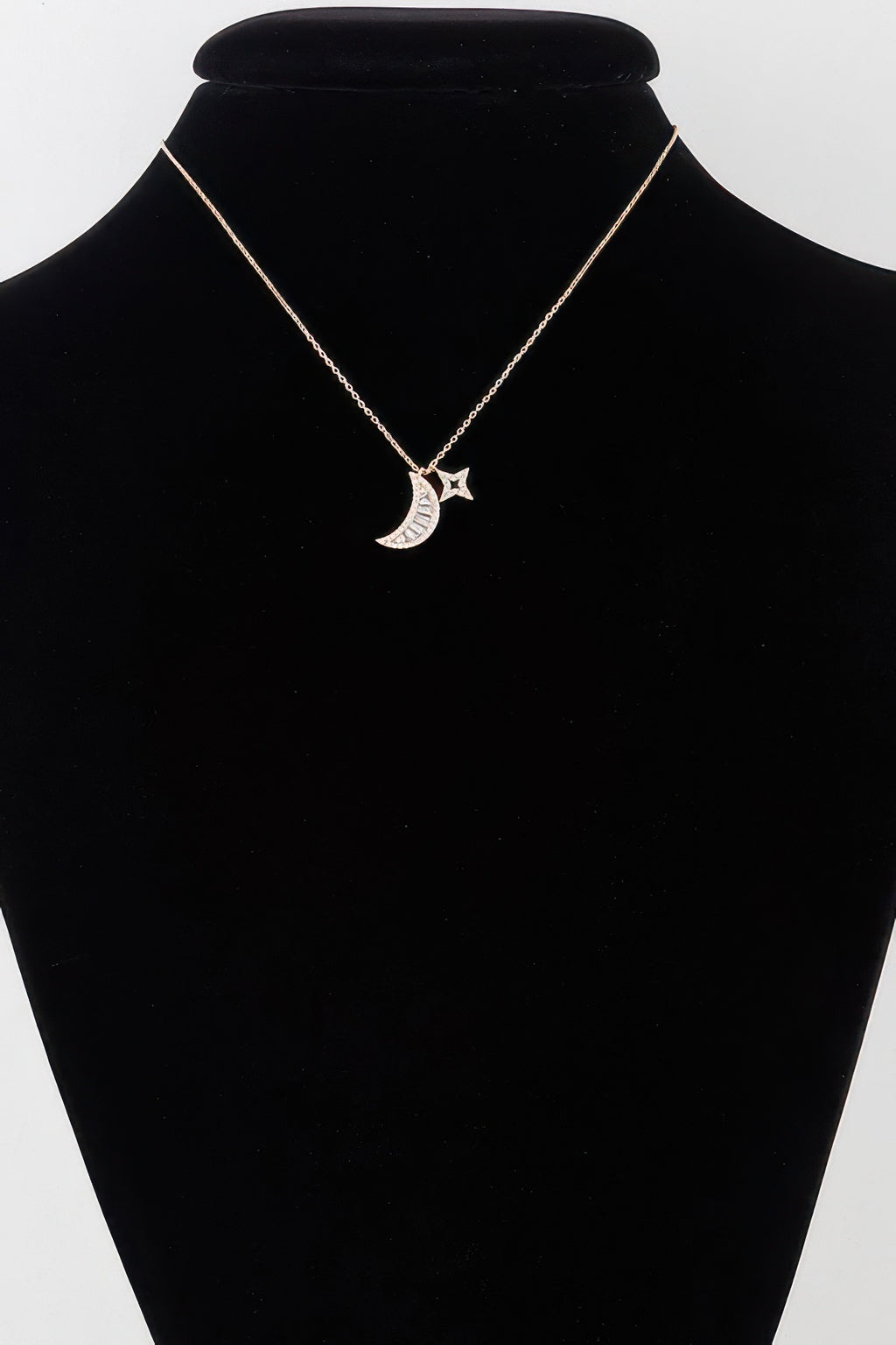 Jeweled Sun N Moon Necklace on mannequin: gold tone crescent moon and star pendant