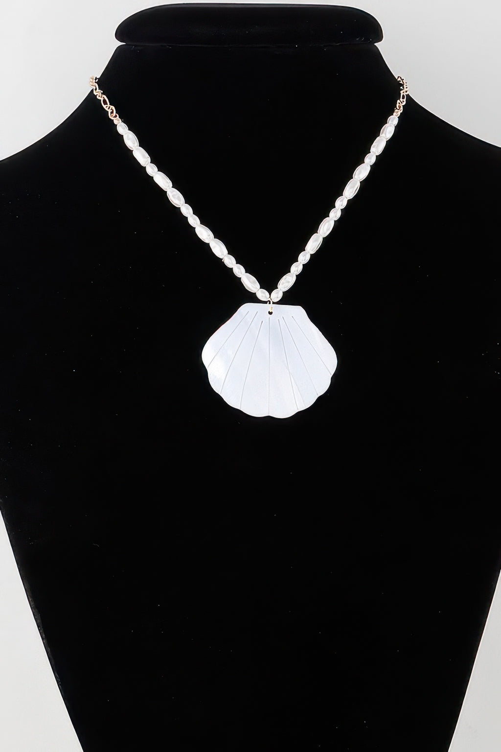 Marbled seashell bead necklace with white shell pendant and pearl-like bead chain