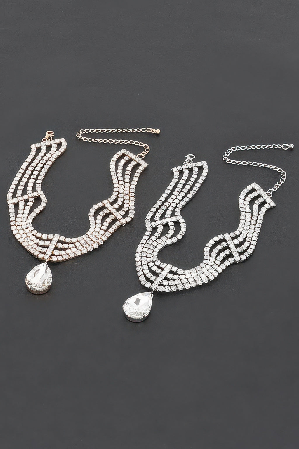 Rhinestone statement earrings with layered clear stones and teardrop drops