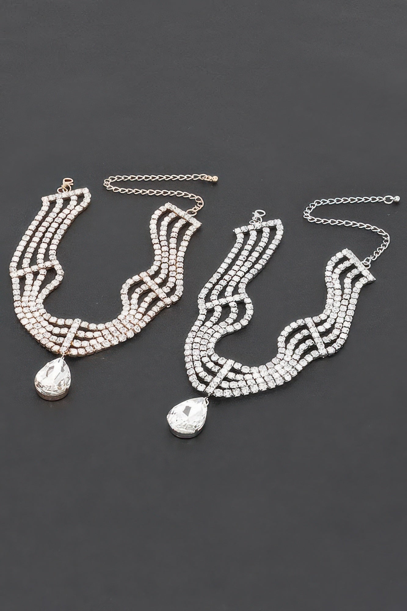Rhinestone statement earrings with layered clear stones and teardrop drops