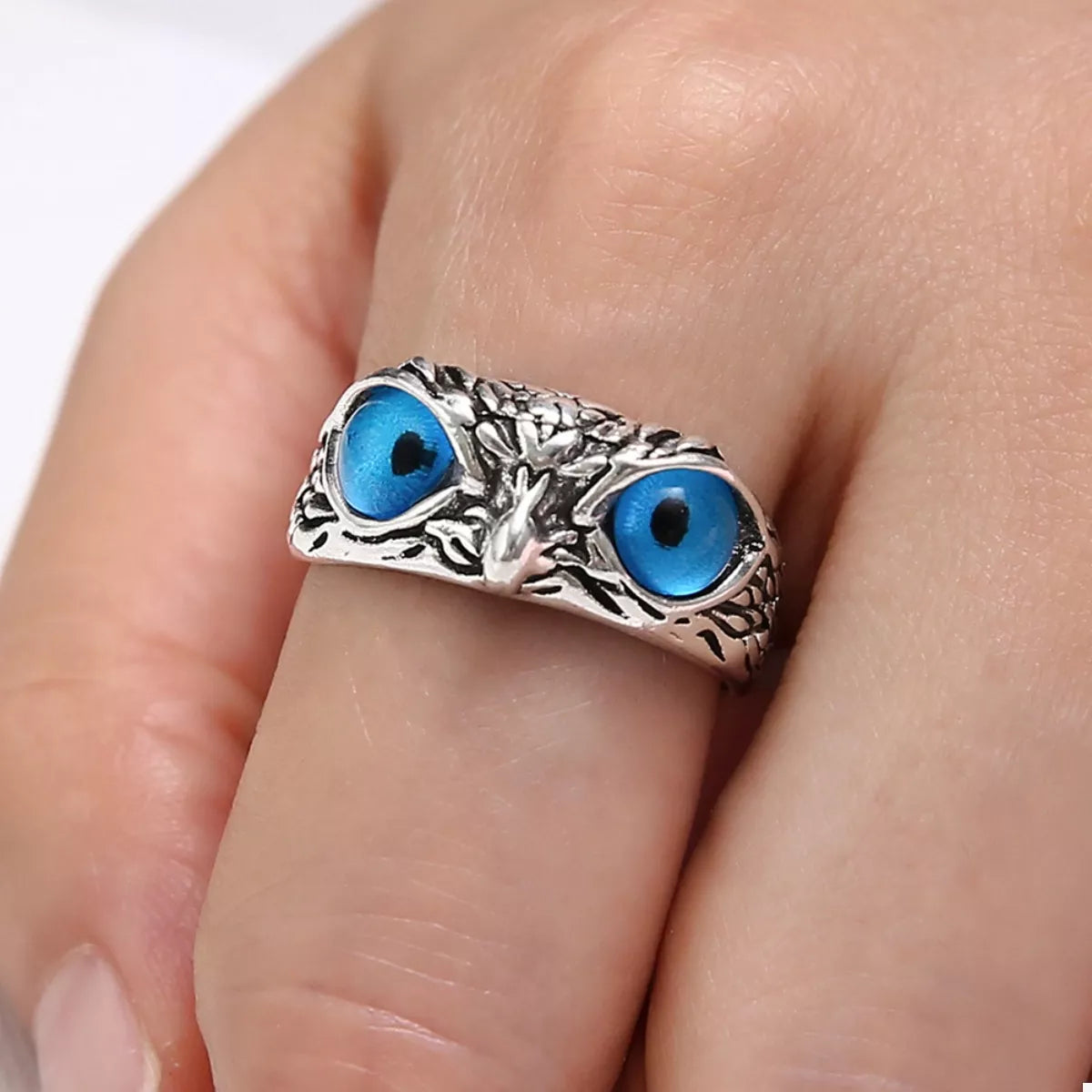 Silver owl eyes ring with two blue eye cabochons and ornate textured band
