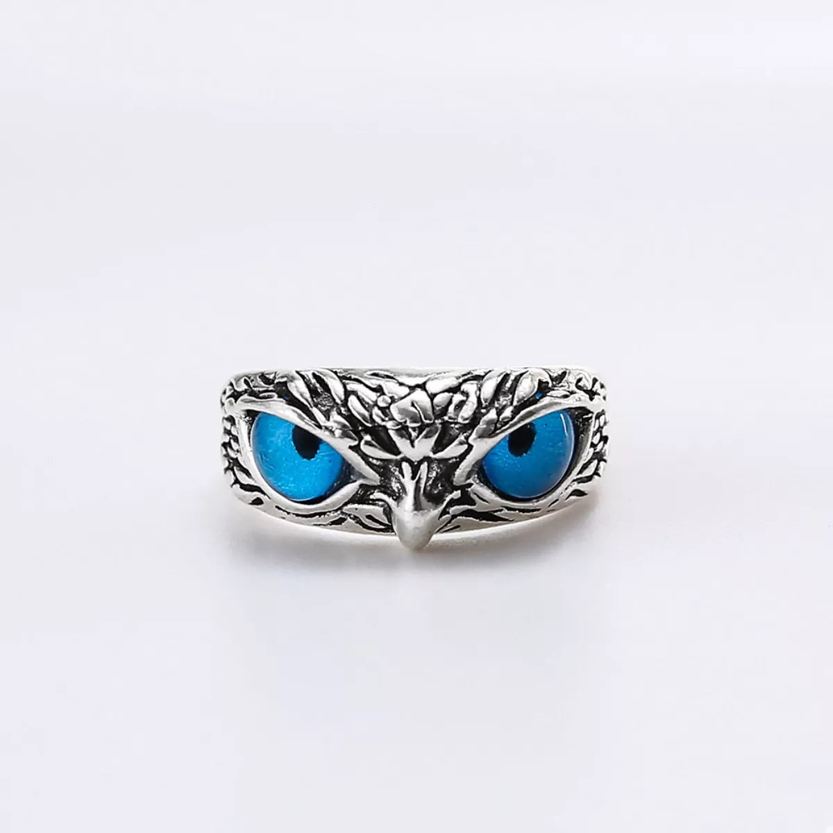 Silver owl eyes ring, centered front design with two bright blue eye cabochons