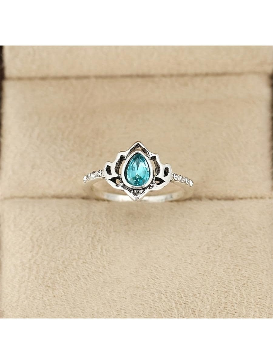 Silver lotus ring, size 8, blue oval stone with accent cutouts on band