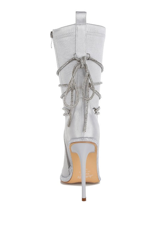 Back view of light silver calf boots with hanging rhinestone tassels, 4-inch heels
