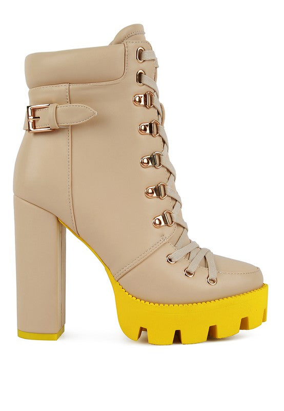 Beige biker boot with buckles and lace-up front, chunky yellow platform sole