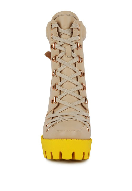 Beige front view lace-up biker boot with buckle eyelets and yellow platform