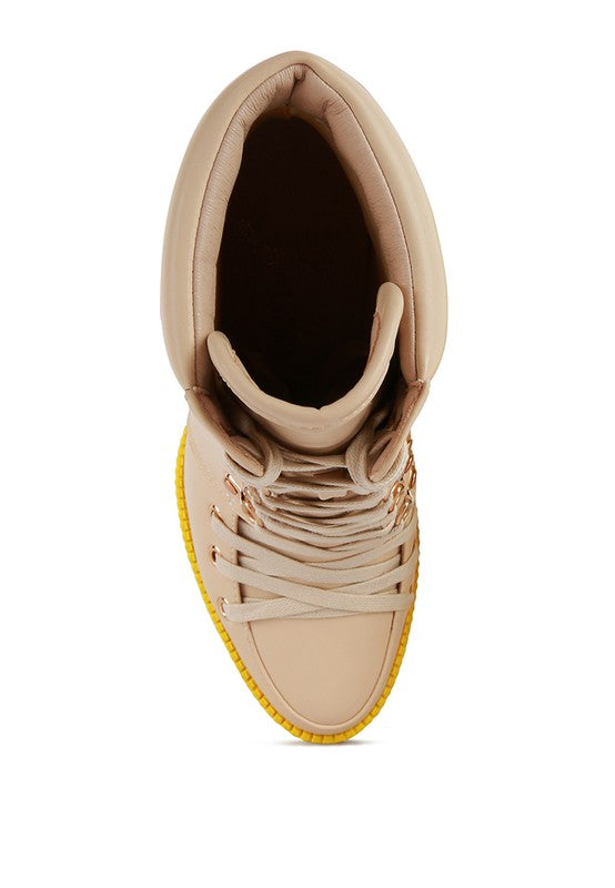 Beige boot with crisscross laces and yellow platform sole