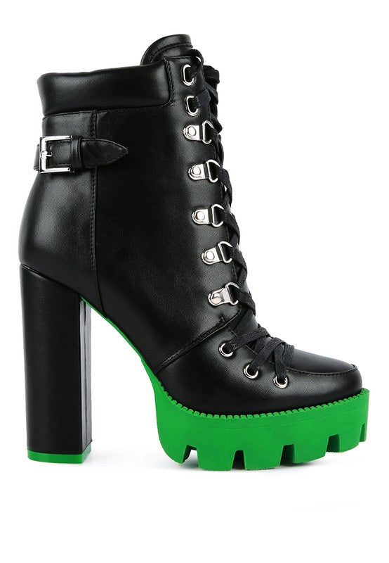Black lace-up biker boot with metal hardware and green platform sole