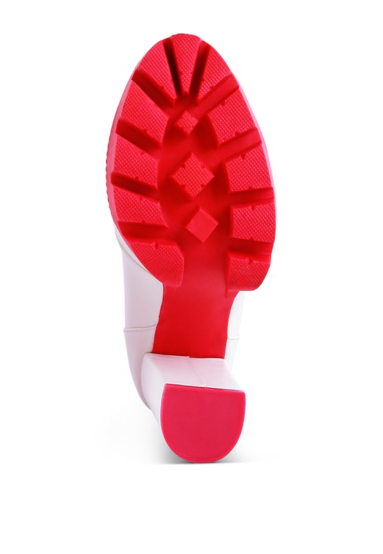 Red lug sole and heel of cushion collared biker boot, underside view