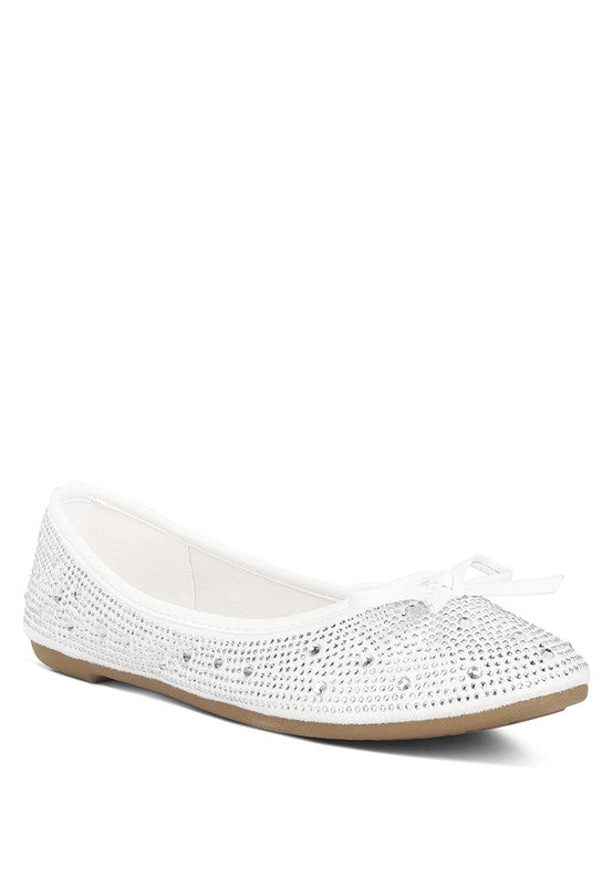 Off-white ballet flats with rhinestones and studs, bow-tie detail at toe