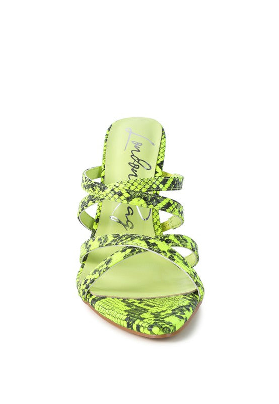 Neon yellow snake-print slide heels with crisscross straps, open toe