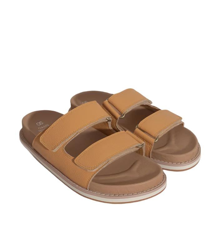 Sienna Cognac double-strap slide sandals, angled view with two tan straps and white sole trim
