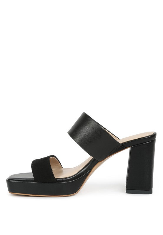 Black platform slide sandals with wide strap and tall block heel