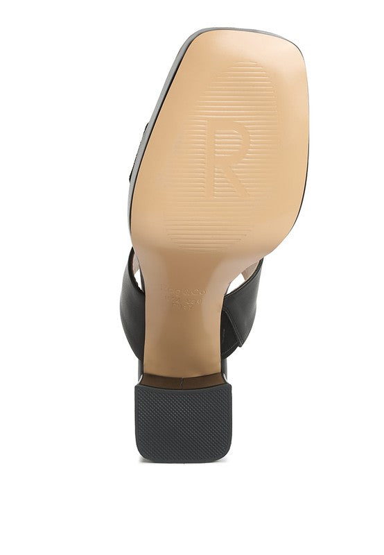 Tan insole view on black platform slide sandal with sculpted tread