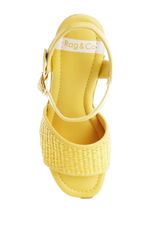 Yellow raffia platform sandals with adjustable ankle strap and cushioned insole