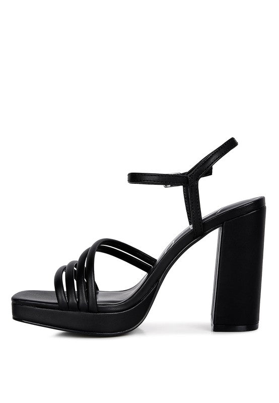 Black strappy platform high-heel sandals with ankle strap and buckle