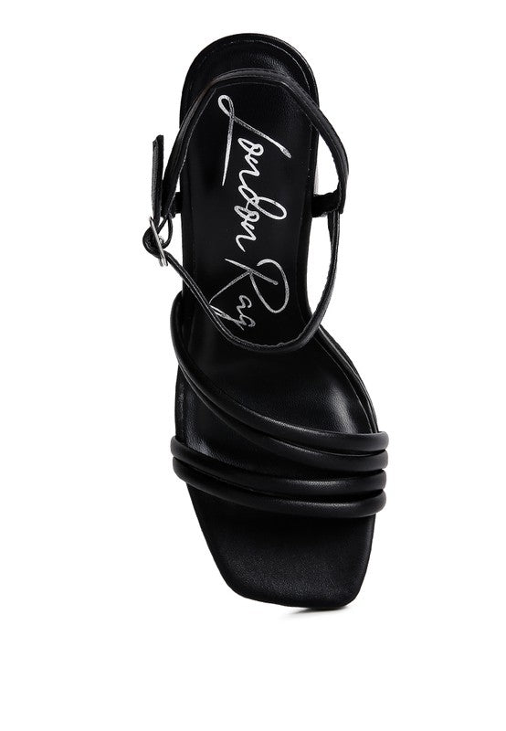 Black platform high-heel sandals side view with crisscross ankle straps