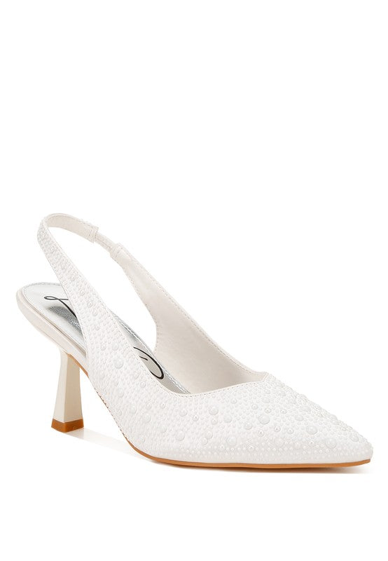 White slingback sandals with pointed toe, textured stud finish, and block heel