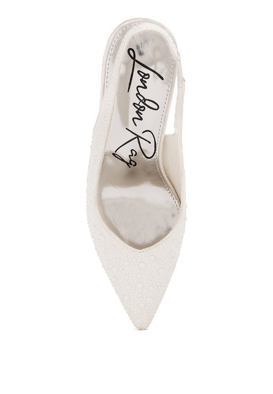 White pointed-toe slingback showing interior logo and slim slingback strap