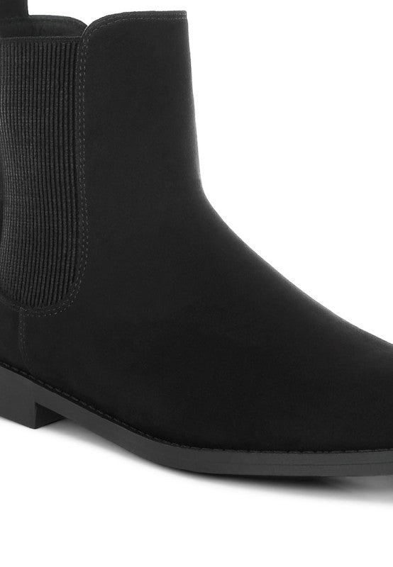 Black Ayasa chelsea boots close-up: smooth upper and elastic gore panels
