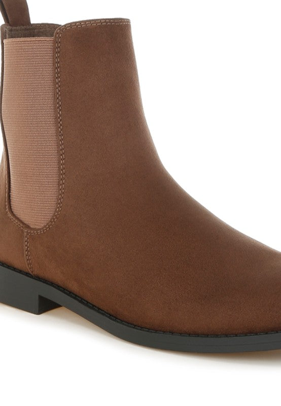 Brown Ayasa chelsea boots close-up showing suede-like upper and elastic gore
