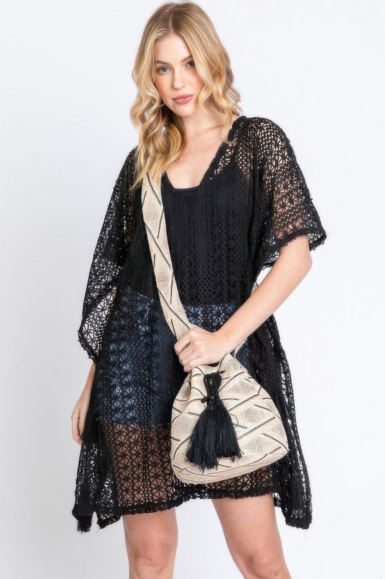 Aztec bucket bag with black tassel and beige Aztec strap