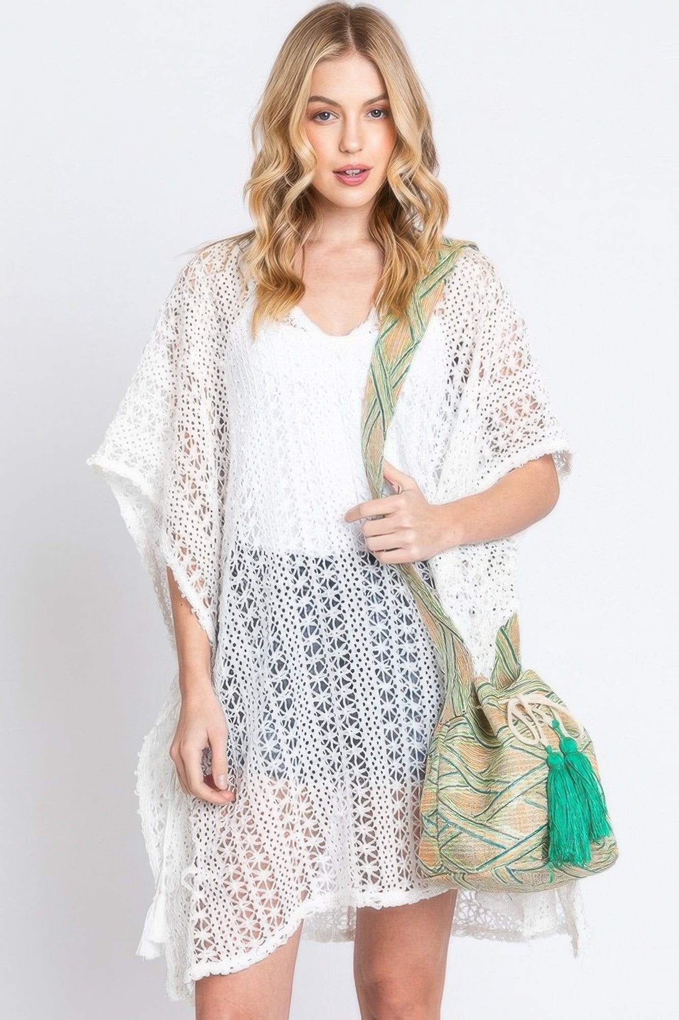 Aztec bucket bag in green with green tassel and Aztec patterned strap