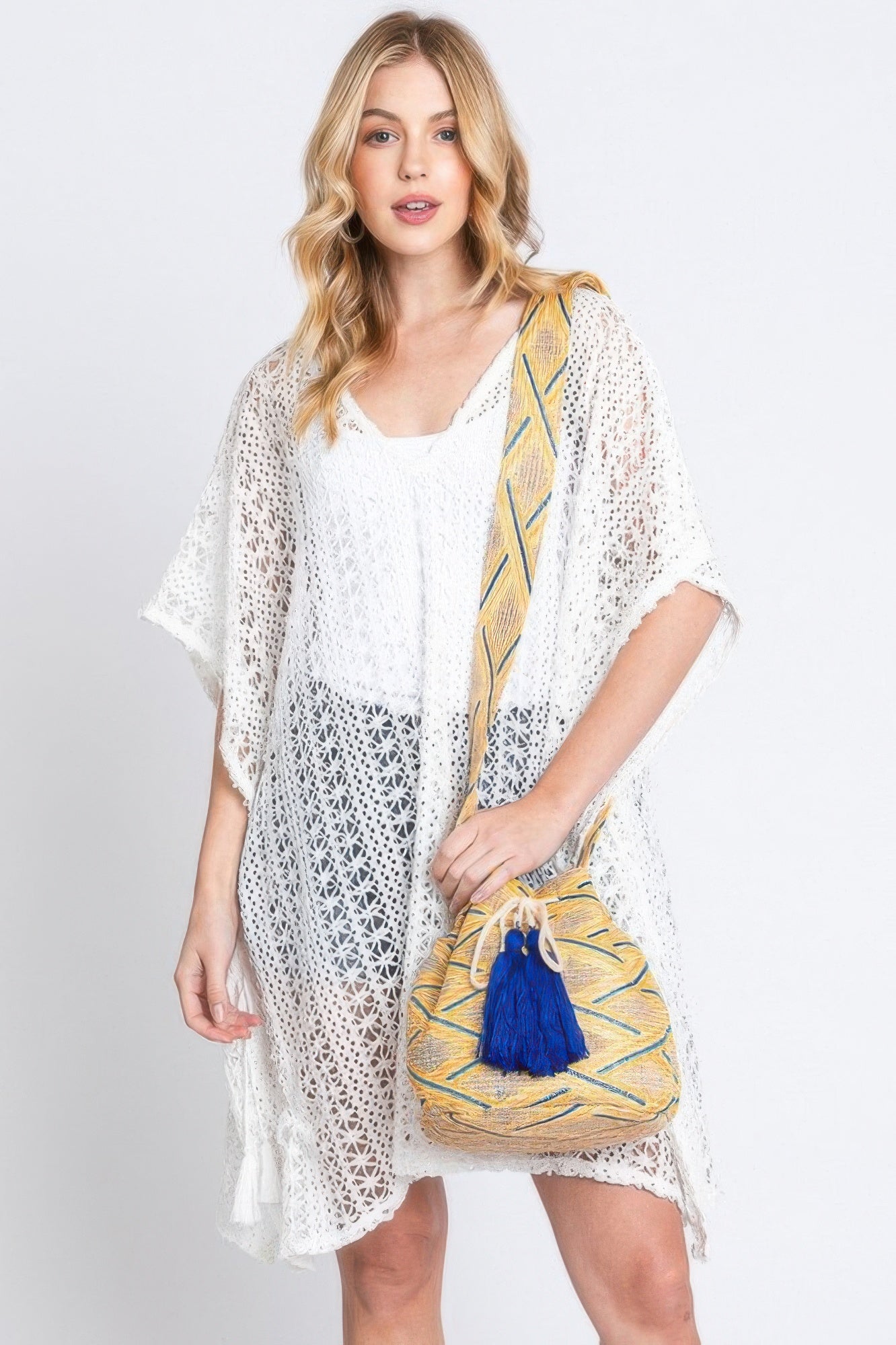 Aztec bucket bag in mustard/yellow with blue tassel and Aztec strap