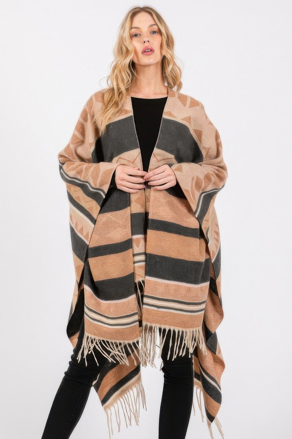 Aztec-pattern ruana poncho with black fringe and tan/gray geometric stripes