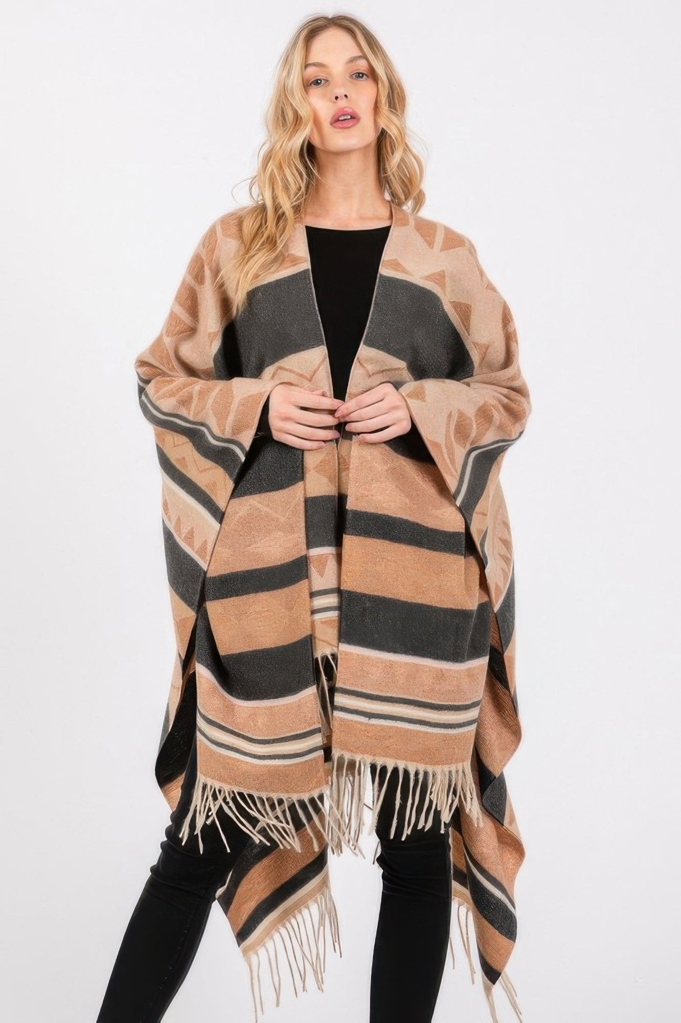 Aztec-pattern ruana poncho with black fringe and tan/gray geometric stripes