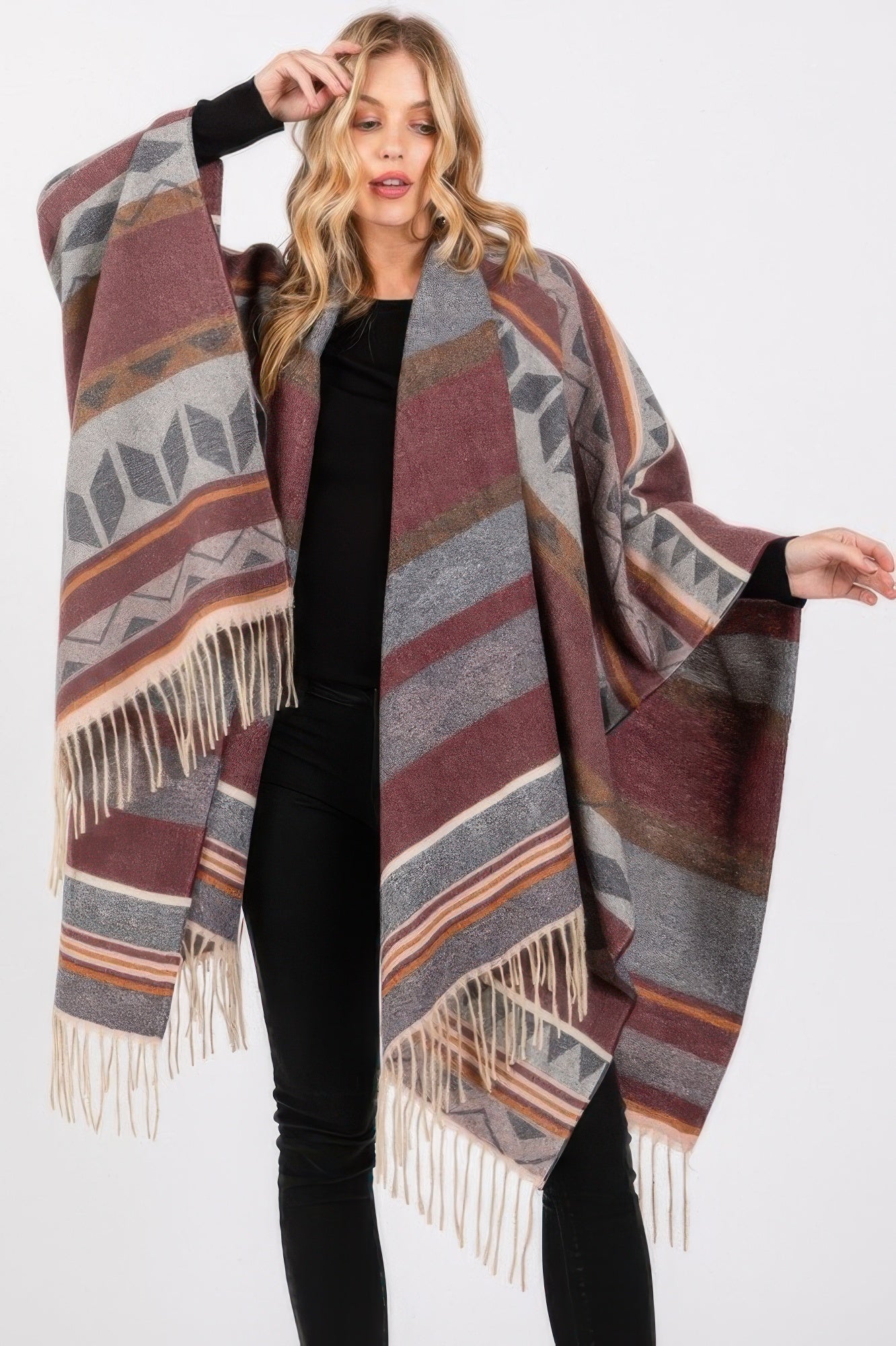 Burgundy and gray Aztec-pattern ruana with striped design and fringe trim