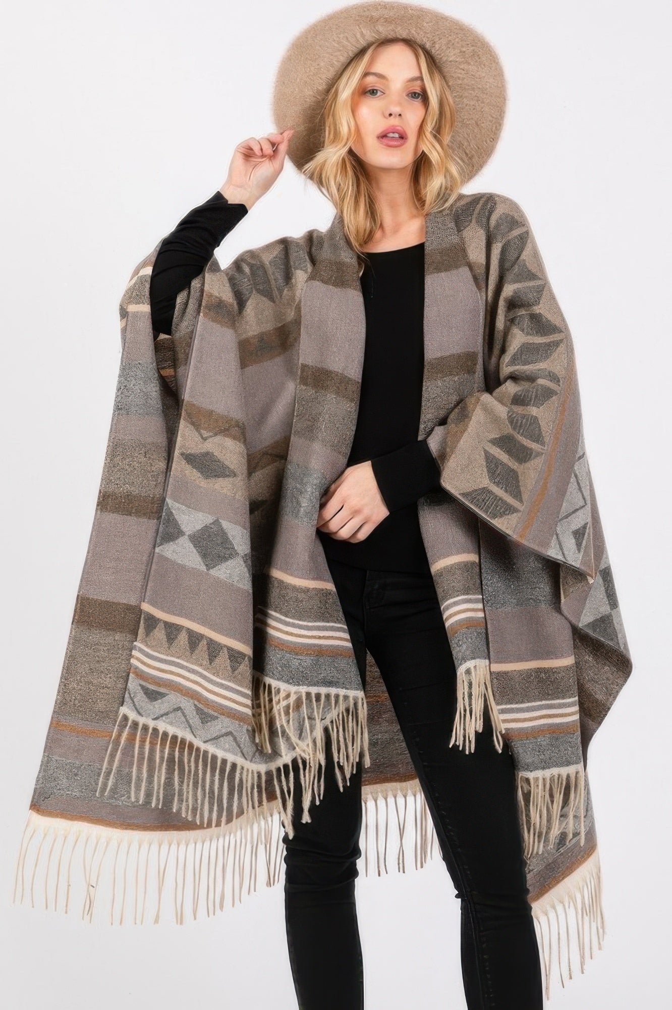 Gray Aztec-pattern ruana with geometric blocks and cream fringe at hem